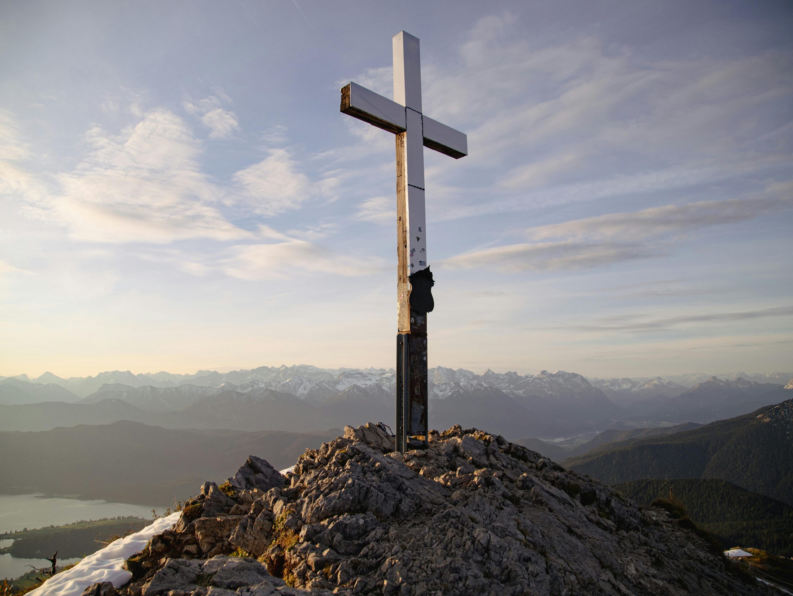 Panoramic alpine scenery with a cross on the summit in Garmisch-Partenkirchen, Germany.